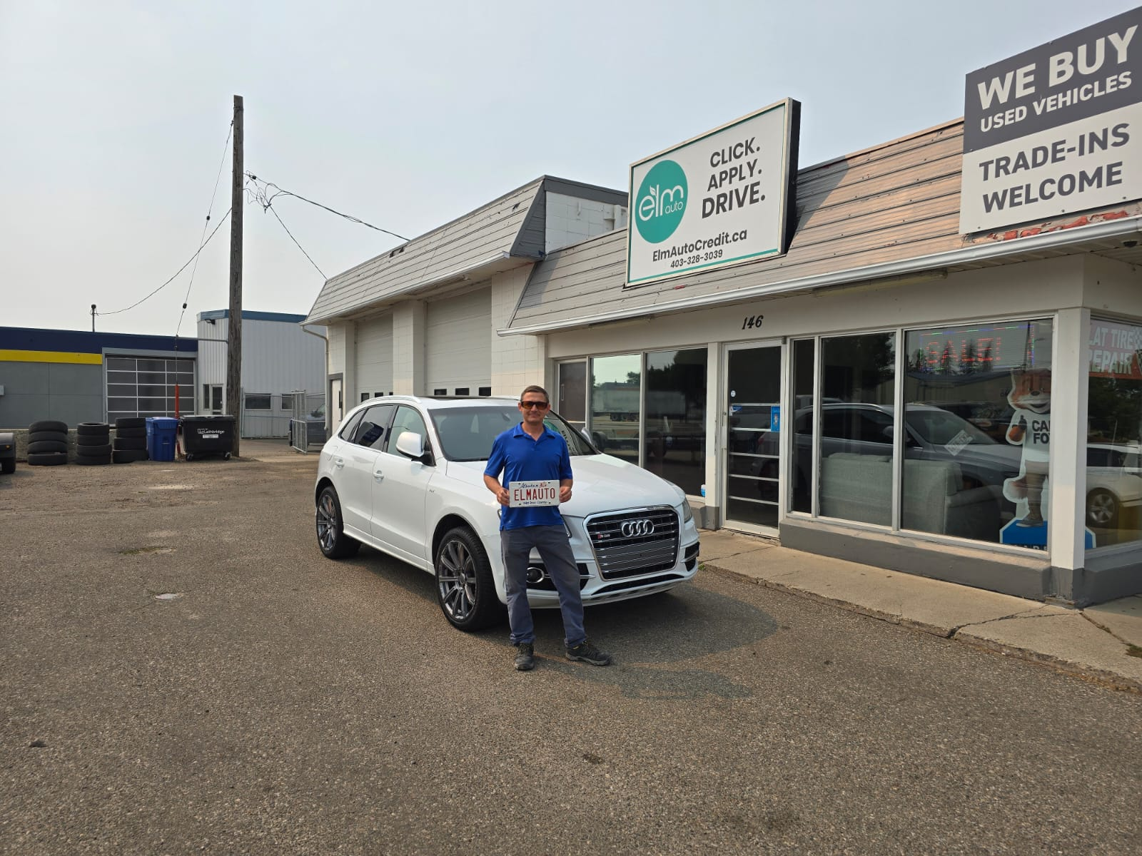 ELM Auto customer with their vehicle