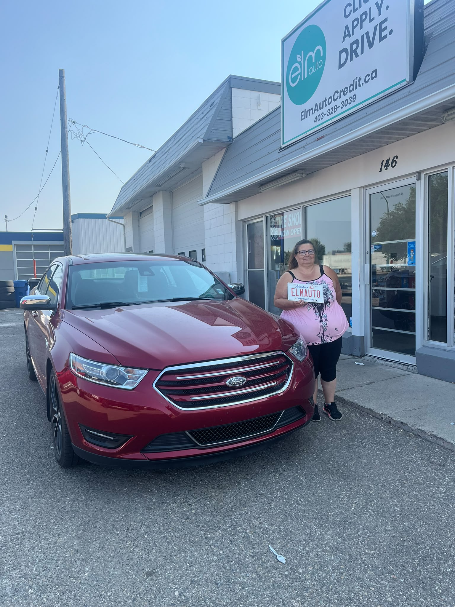 ELM Auto customer with their vehicle