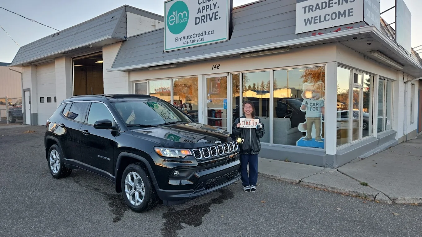 ELM Auto customer with their vehicle