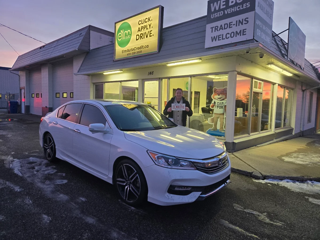 ELM Auto customer with their vehicle