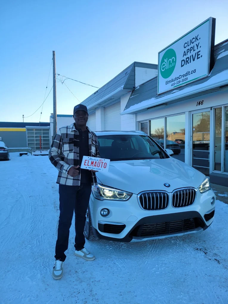 ELM Auto customer with their vehicle